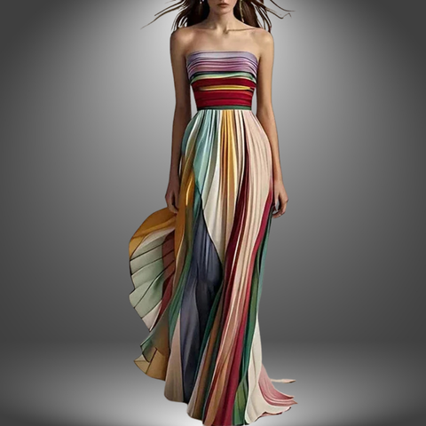 Woman wearing strapless maxi dress with multicolored vertical stripes in red, pink, blue, green, and cream, holding draped