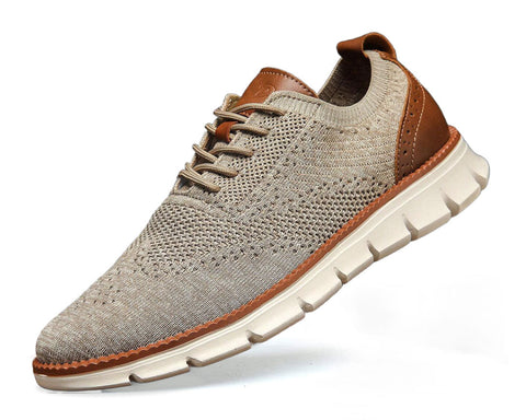 Beige knit sneaker with cognac brown leather accents, cream rubber sole with treaded pattern, laced closure, angled side