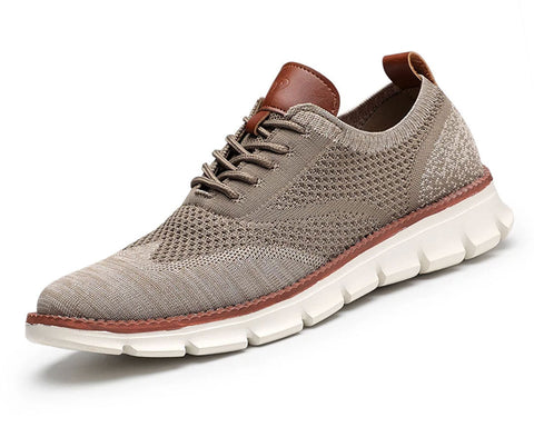 Gray knit lace-up sneaker with brown leather heel collar and white chunky sole, shown in side profile against white