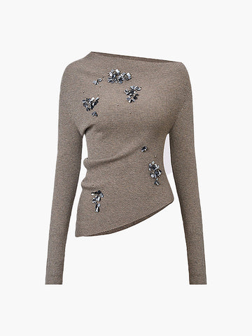 Taupe knit sweater with long sleeves and asymmetrical hemline, decorated with scattered blue rhinestone embellishments