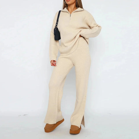 Woman wearing cream ribbed knit two-piece set with half-zip hoodie and flared pants, brown suede platform shoes, black